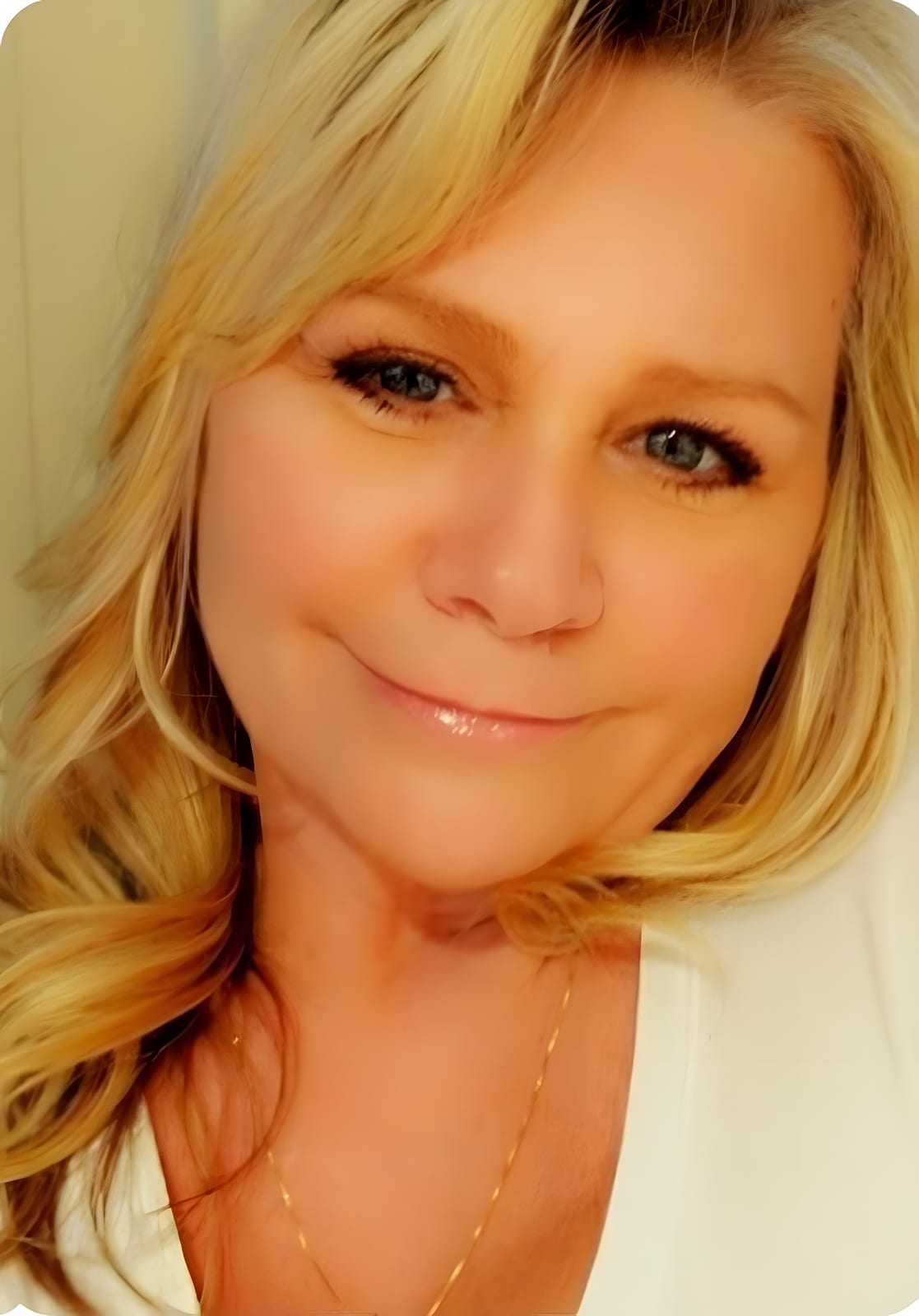 Close-up of a smiling blonde team member